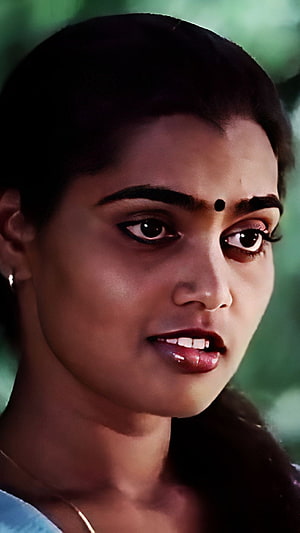 Silk Smitha Tamil Actress Portrait with Traditional Bindu and Soft Green Background HD phone wallpaper