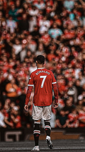 Cristiano Ronaldo Walking Away in Manchester United Red Kit Before Crowd HD phone wallpaper