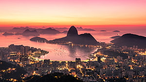 Rio De Janeiro skyline at sunrise with Sugarloaf Mountain and Guanabara Bay HD wallpaper