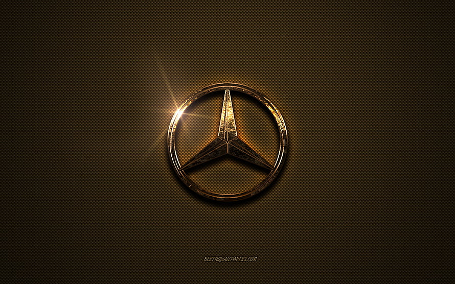 Mercedes-Benz Golden Emblem on Textured Brown Metal Surface with Dramatic Lens Flare HD wallpaper