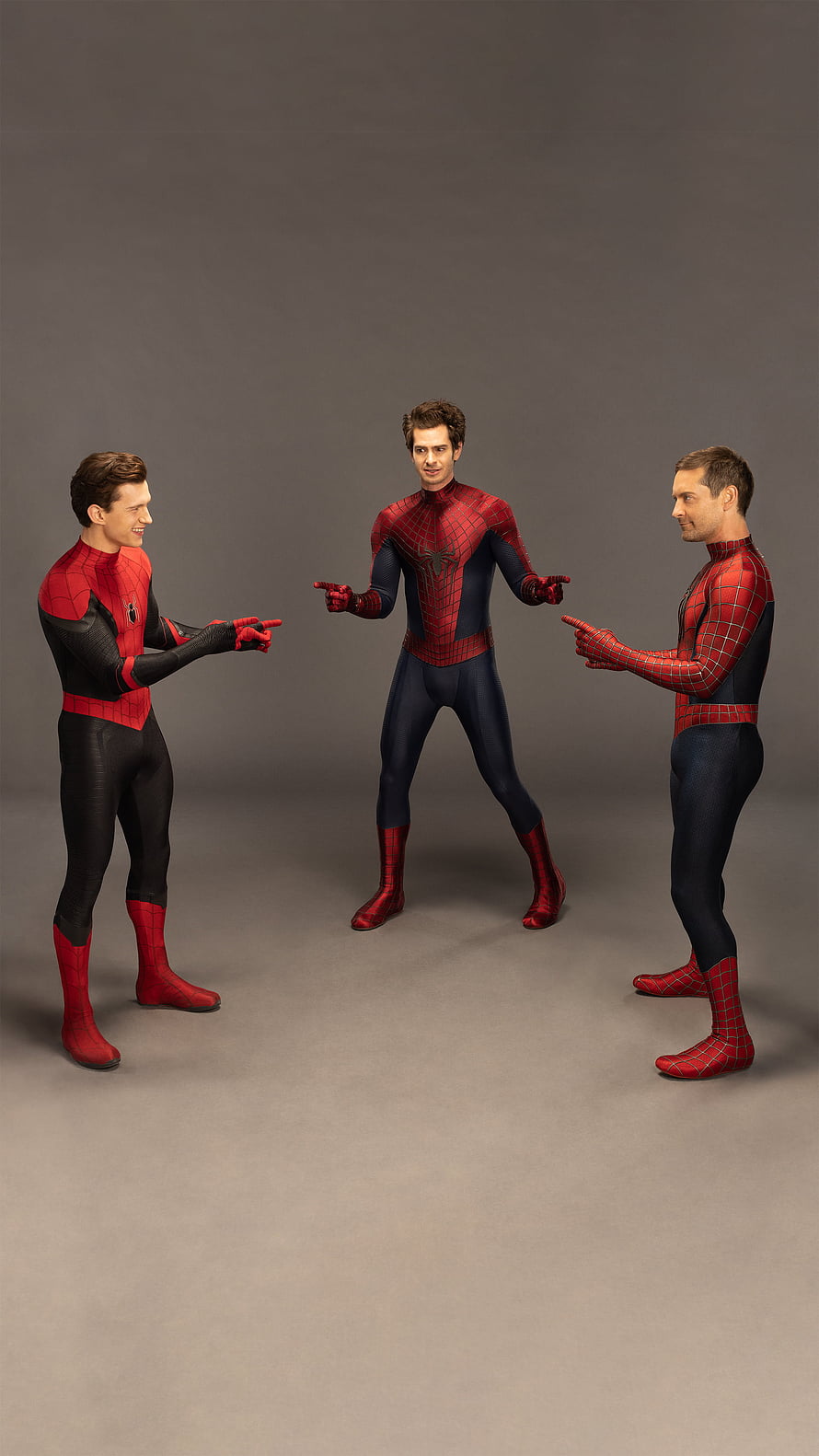 Three Spider-Man Actors Pointing at Each Other in Studio Setting HD phone wallpaper
