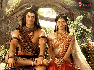 Mahadev and Sati in a lush forest setting from the Indian mythological series HD wallpaper