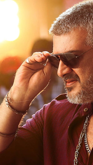 Ajith Kumar in Aviator Sunglasses and Maroon Shirt with Golden Backlight HD phone wallpaper