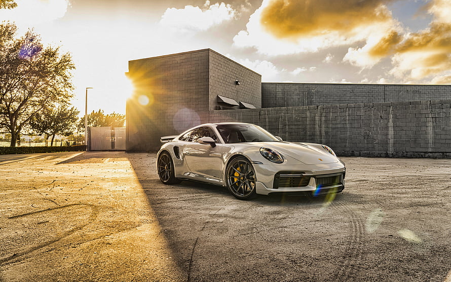 White Porsche 911 Turbo S 992 Coupe Parked in Industrial Lot at Golden Hour HD wallpaper