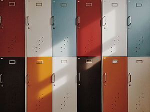 Retro Multicolored Locker Doors With Minimalist Design And Natural Light HD wallpaper