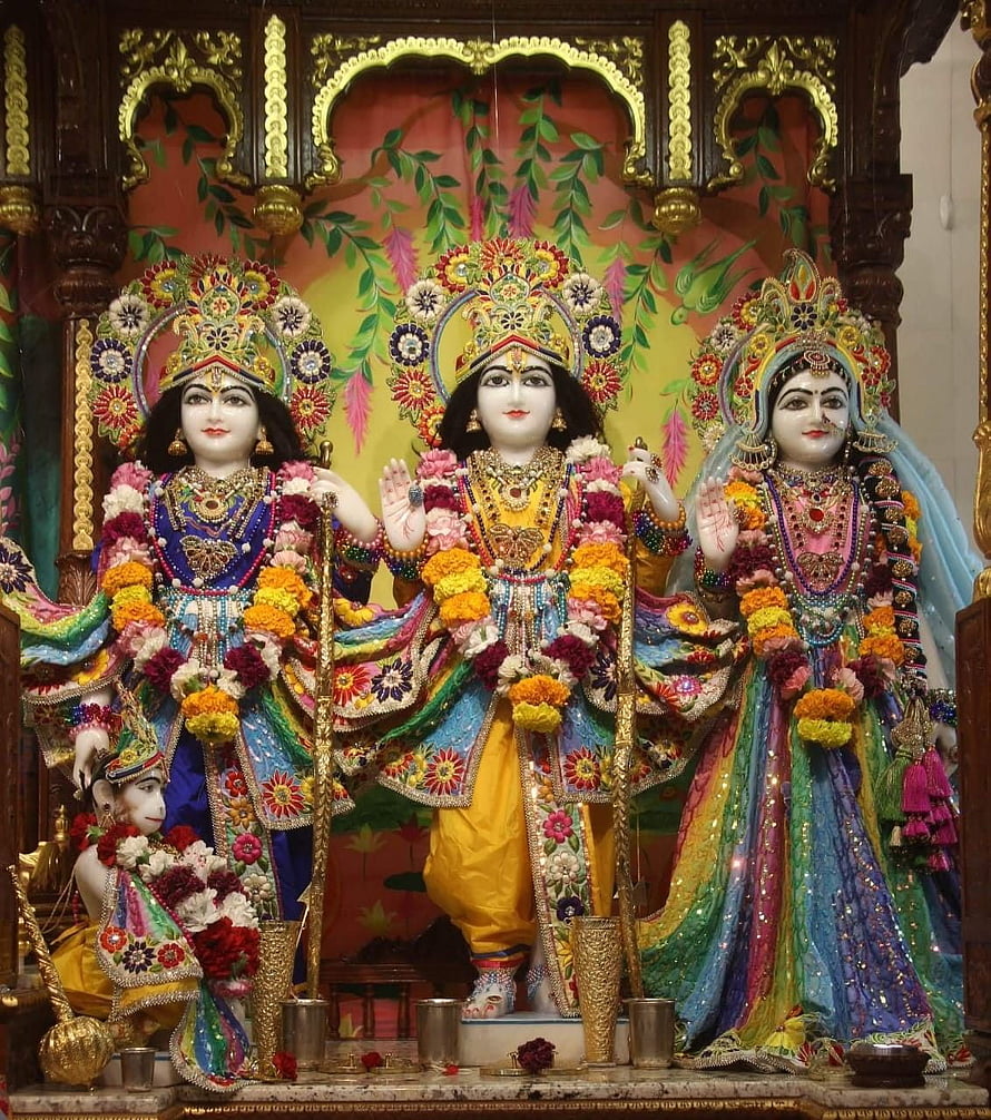 Lord Rama, Sita, and Lakshmana Darbar with Elaborate Floral Garlands and Ornate Temple Decor HD phone wallpaper