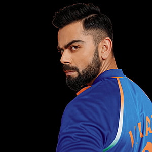 Virat Kohli in Indian Cricket Jersey with Intense Side Profile Gaze HD phone wallpaper
