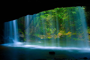 Hidden Waterfall Pool Viewed From Inside a Lush Forest Cave HD wallpaper