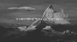 Black and White Snow-Capped Mountain Peak with Motivational Quote Overlay HD wallpaper