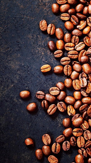 Roasted Coffee Beans Scattered on Dark Textured Surface HD phone wallpaper