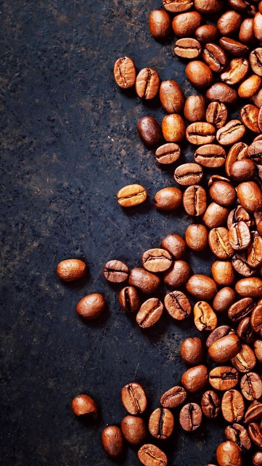 Roasted Coffee Beans Scattered on Dark Textured Surface HD phone wallpaper