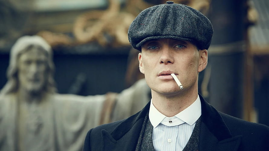Tommy Shelby from Peaky Blinders in Flat Cap and Dark Coat with Cigarette HD wallpaper