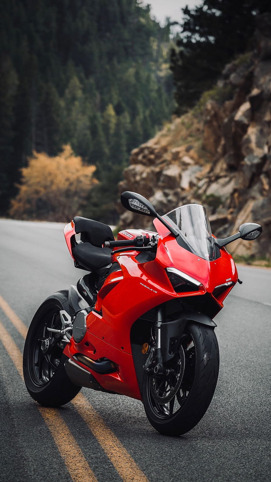 Red Ducati Panigale V4 Superbike Parked on a Winding Mountain Road HD phone wallpaper