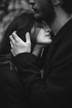 Intimate Black and White Portrait of a Couple Sharing a Tender Moment HD phone wallpaper