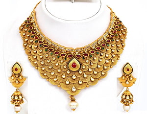 Traditional Indian Gold Necklace Set with Ruby and Pearl Accents HD wallpaper