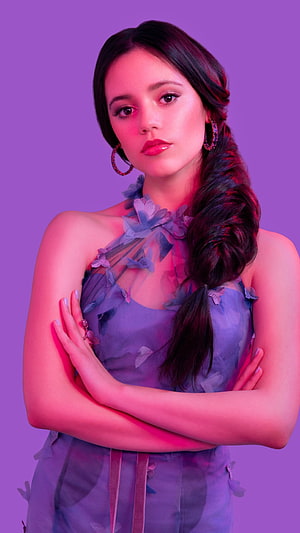 Jenna Ortega in a floral halter dress with a side braid under pink and purple studio lighting HD phone wallpaper