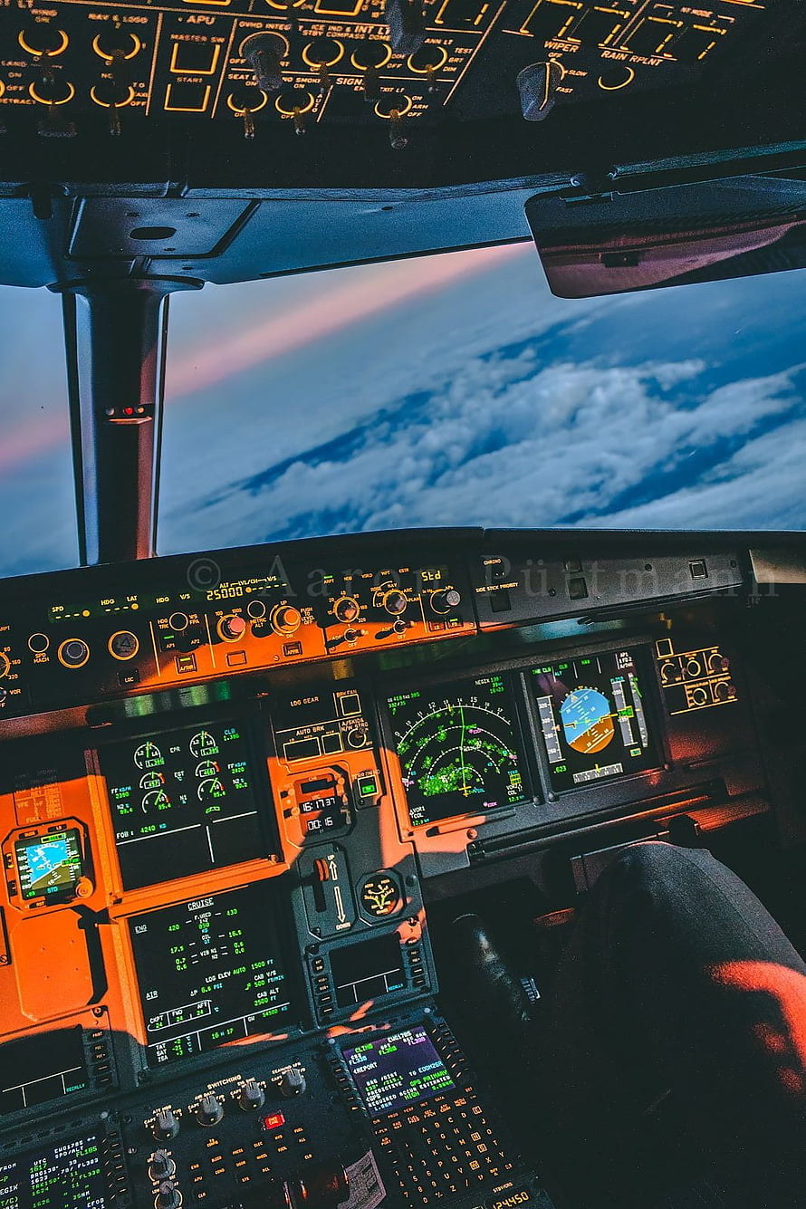Airbus A320 Cockpit View at Sunset with Digital Flight Instruments and Clouds HD phone wallpaper
