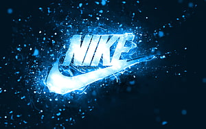 Glowing Nike Swoosh Logo With Electric Blue Particle Effects On Dark Background HD wallpaper