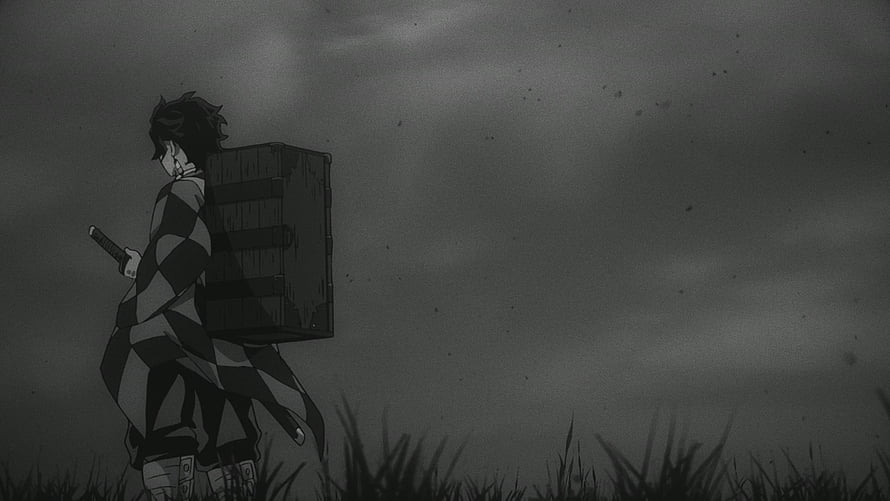 Tanjiro Kamado Carrying Bamboo Crate in Dark Grayscale Demon Slayer Scene HD wallpaper