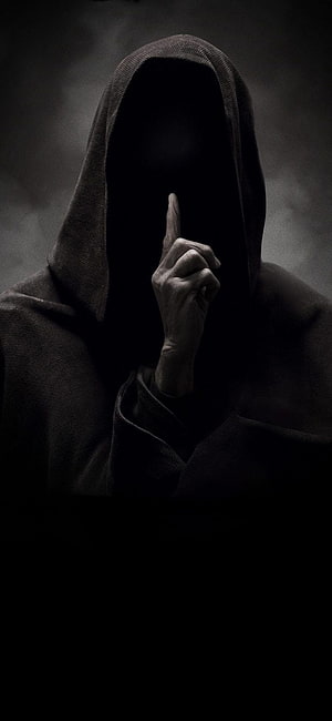 Mysterious Hooded Figure Making Shushing Gesture in Dark Cinematic Style HD phone wallpaper