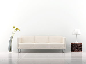 Minimalist White Living Room With Modern Sofa, Table Lamp, And Tall Glass Vase HD wallpaper