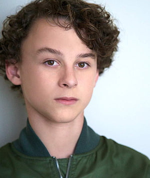 Wyatt Oleff Portrait in Green Bomber Jacket with Curly Hair HD phone wallpaper