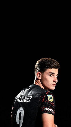 Julian Alvarez in LAFC Black Jersey Looking Over Shoulder Against Dark Background HD phone wallpaper