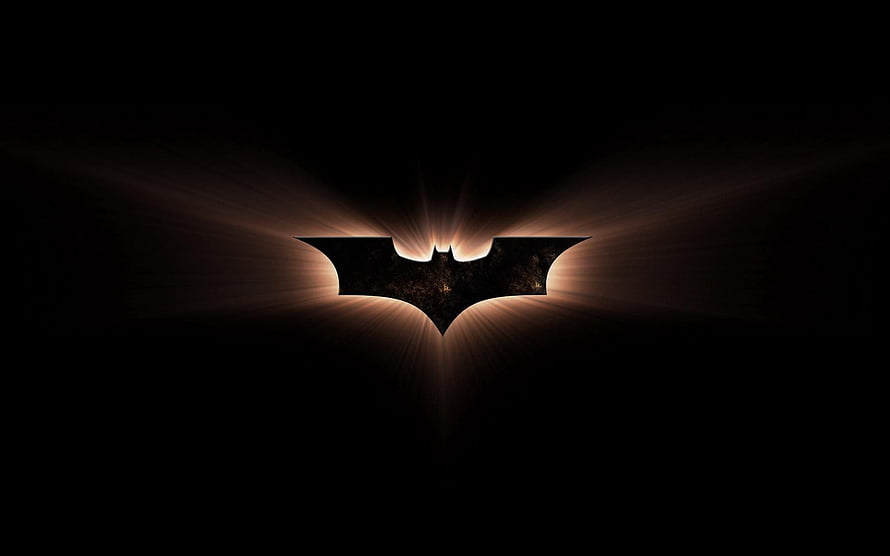 Glowing Batman Logo on Black Background with Dramatic Light Rays HD wallpaper