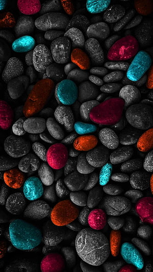 Vibrant Painted Pebbles on Dark Background HD phone wallpaper