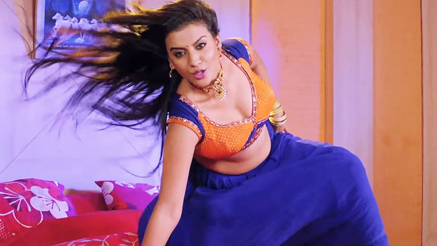 Akshara Singh in Vibrant Orange and Blue Traditional Attire with Flowing Hair HD wallpaper