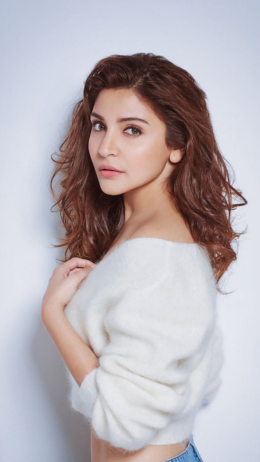 Anushka Sharma in White Off-Shoulder Knit Top with Wavy Brown Hair HD phone wallpaper