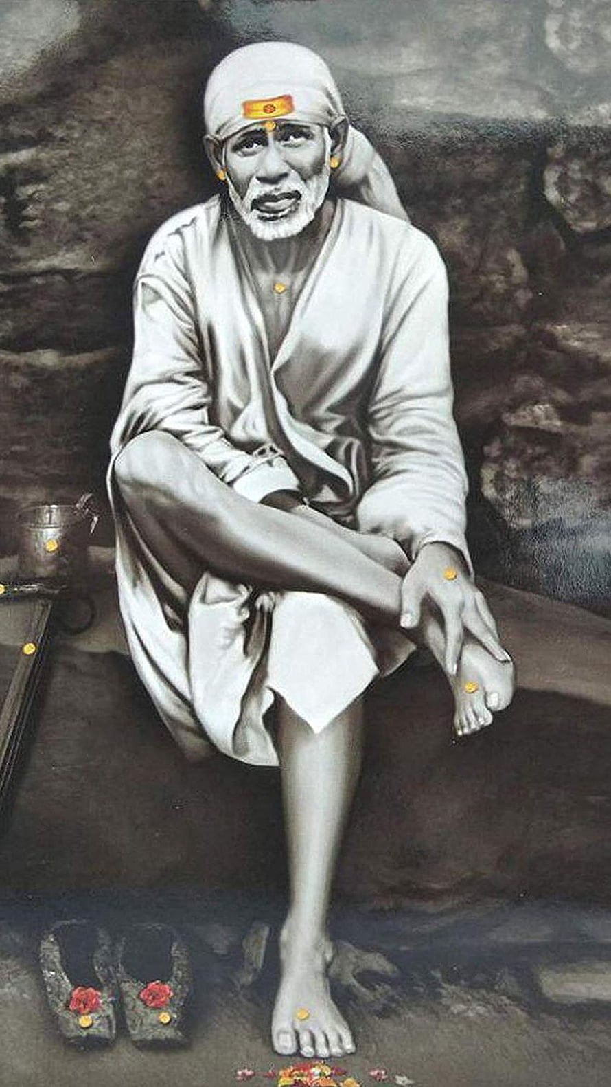 Sai Baba seated in white robes with sacred tilak marks and traditional footwear HD phone wallpaper