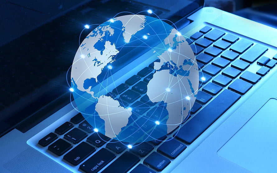 Glowing Digital Globe with Network Connections Hovering Over a Modern Laptop Keyboard HD wallpaper