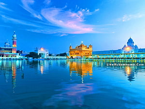 Golden Temple Amritsar at Night with Illuminated Reflections in the Sacred Pool HD wallpaper