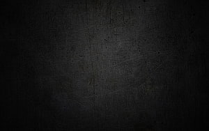 Dark scratched metal surface texture with subtle grunge details and industrial wear HD wallpaper