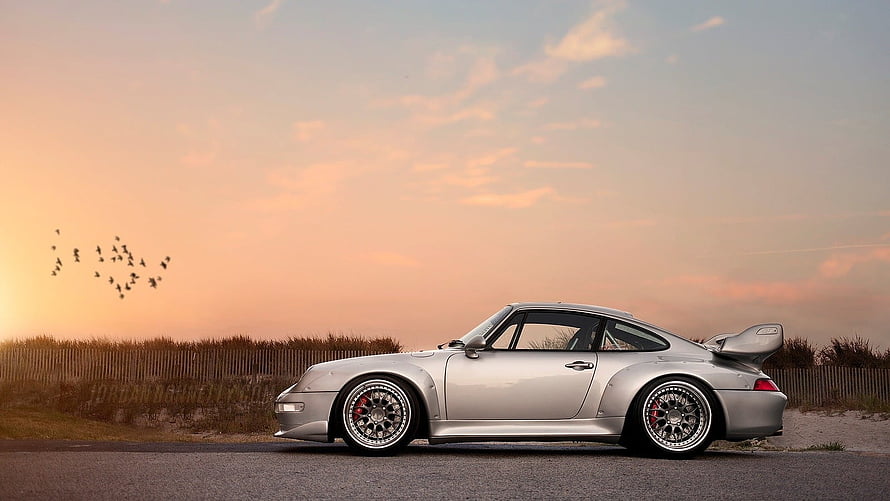 Silver Porsche 993 GT2 Widebody Coupe Parked on Coastal Road at Sunset HD wallpaper
