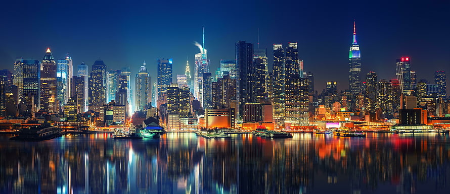 New York City Manhattan Skyline at Night with Waterfront Reflections HD wallpaper