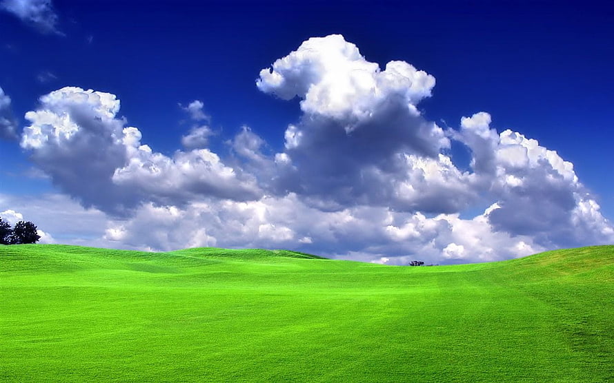 Vast Green Rolling Hills Under a Deep Blue Sky with Dramatic Cumulus Clouds HD wallpaper