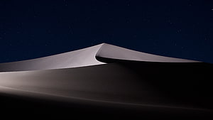 Minimalist Desert Dune Under a Starry Night Sky HD wallpaper