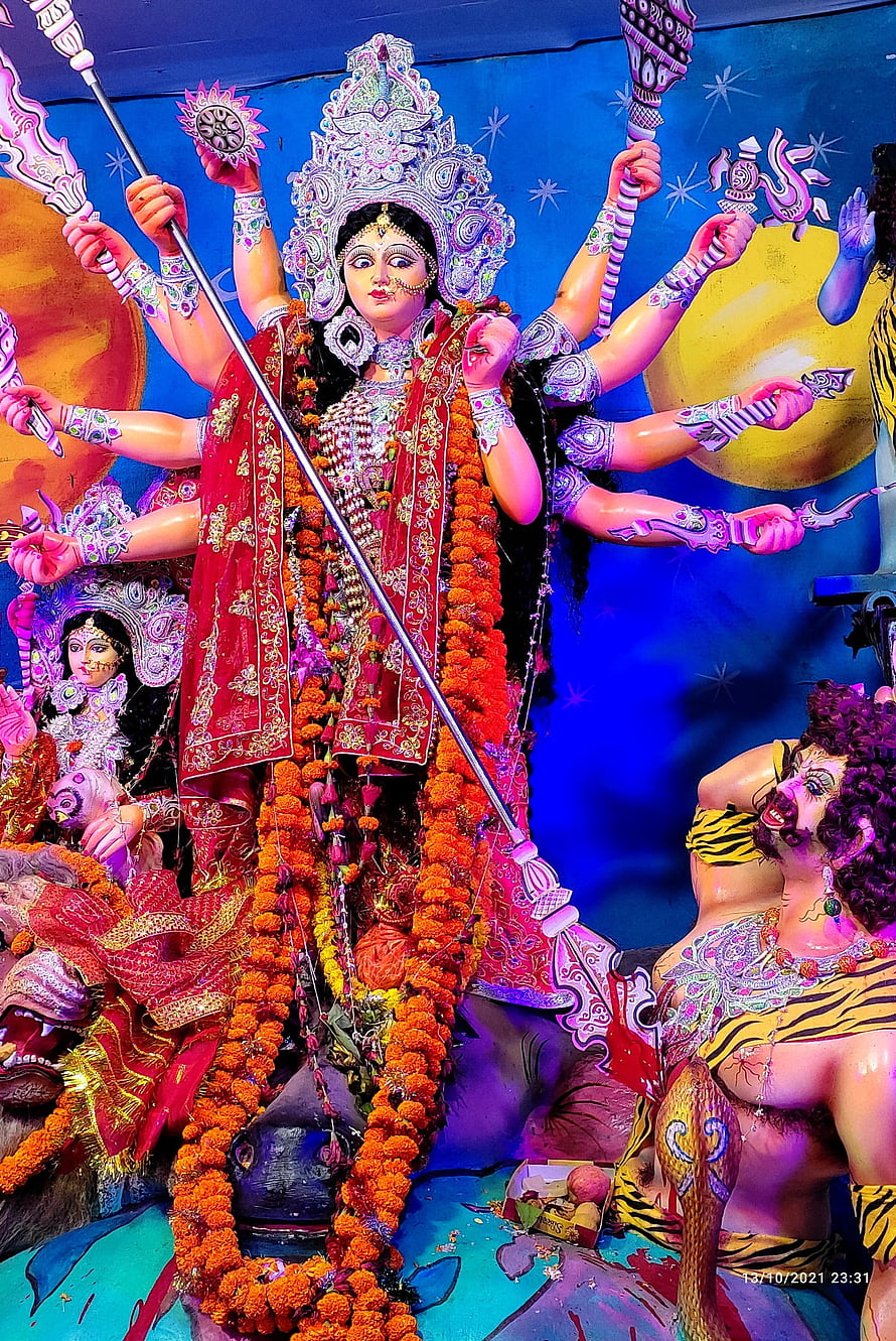 Maa Durga Festival Idol with Multiple Arms and Marigold Garlands HD phone wallpaper