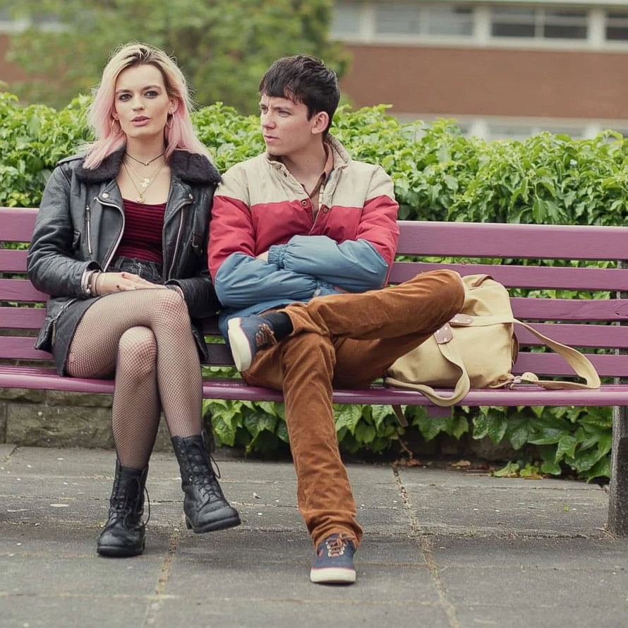Otis Milburn and Maeve Wiley sitting on a purple bench in Sex Education HD phone wallpaper