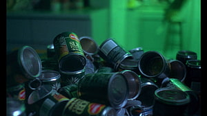 Chungking Express Film Still Featuring Scattered Pineapple Cans in Green Light HD wallpaper