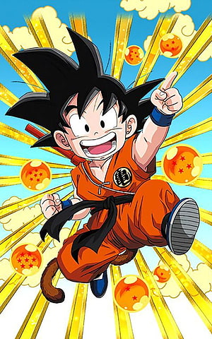 Kid Goku in Orange Gi Surrounded by Dragon Balls and Golden Light Rays HD phone wallpaper