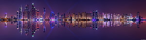 Panoramic Night Skyline with Purple Haze and Water Reflections HD wallpaper