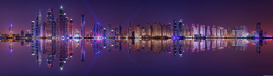 Panoramic Night Skyline with Purple Haze and Water Reflections HD wallpaper
