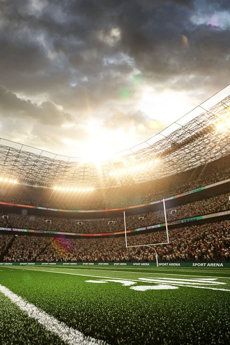 American Football Stadium at Sunset with Goalpost and Crowd HD phone wallpaper