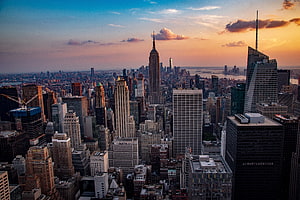 New York City Skyline at Sunset Featuring the Empire State Building and Midtown Manhattan HD wallpaper
