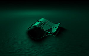 Glossy Green Windows Logo Emblem on Dark Textured Surface HD wallpaper