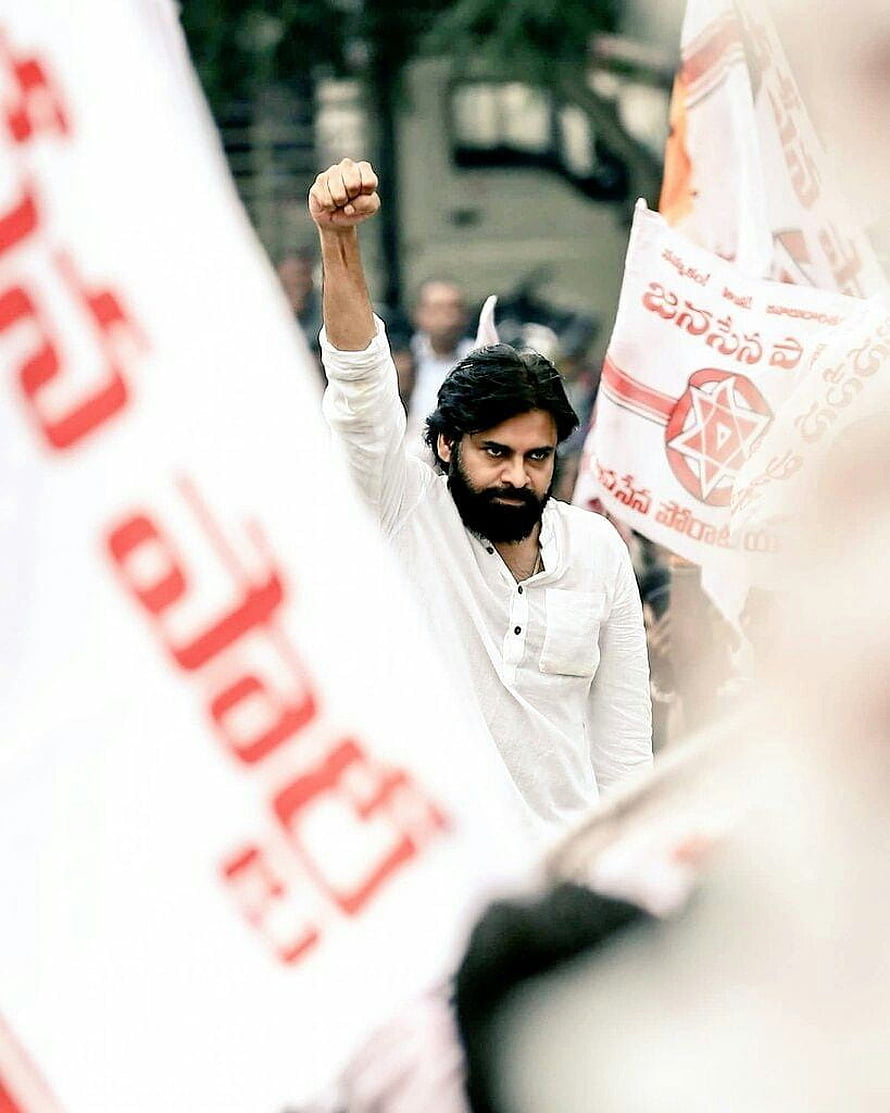 Pawan Kalyan Raising Fist at JanaSena Party Rally with Red and White Banners HD phone wallpaper