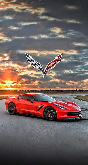 Red Chevrolet Corvette ZR1 on a track at sunset with the iconic crossed-flags emblem floating above HD phone wallpaper